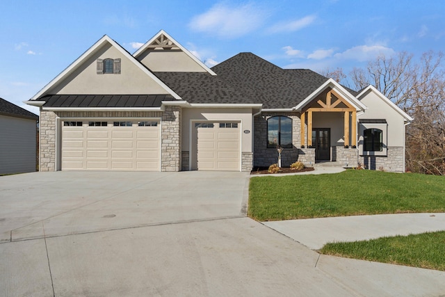 view of front facade with a garage and a front lawn