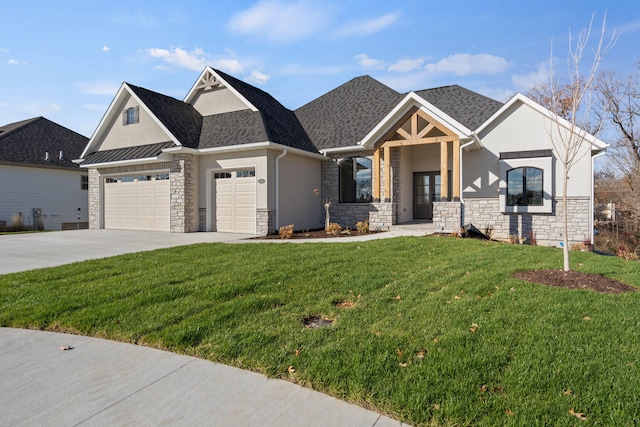 view of front of home with a garage and a front lawn