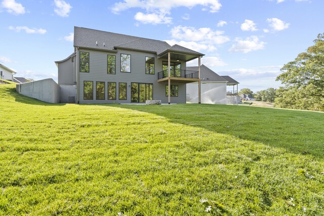 1704 Stillpoint Ct, Columbia, MO 65203 - back of house featuring a balcony and a yard