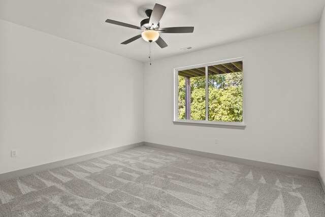 1704 Stillpoint Ct, Columbia, MO 65203 - carpeted spare room featuring baseboards, visible vents, and a ceiling fan