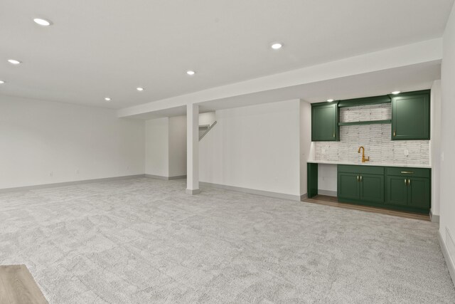 1704 Stillpoint Ct, Columbia, MO 65203 - finished basement featuring a sink, light carpet, baseboards, and recessed lighting