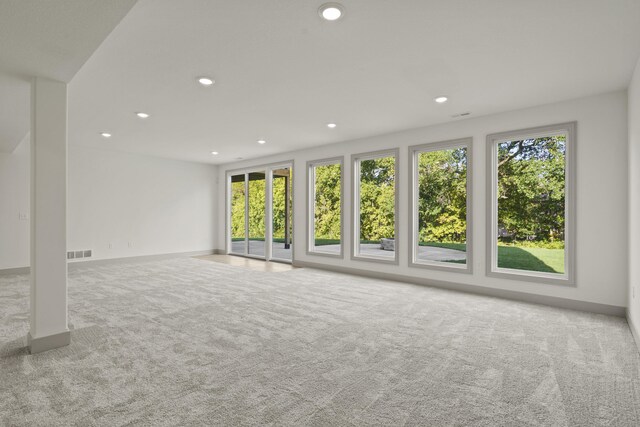 1704 Stillpoint Ct, Columbia, MO 65203 - unfurnished living room featuring recessed lighting, carpet, baseboards, and visible vents