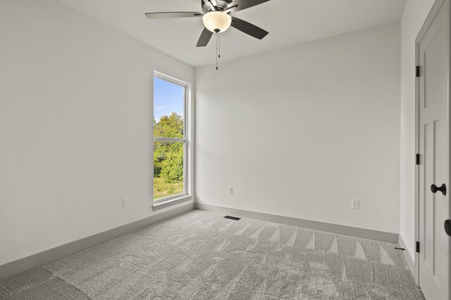 1704 Stillpoint Ct, Columbia, MO 65203 - carpeted spare room featuring a wealth of natural light, visible vents, ceiling fan, and baseboards