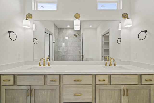 1704 Stillpoint Ct, Columbia, MO 65203 - bathroom featuring double vanity, a sink, and a shower stall