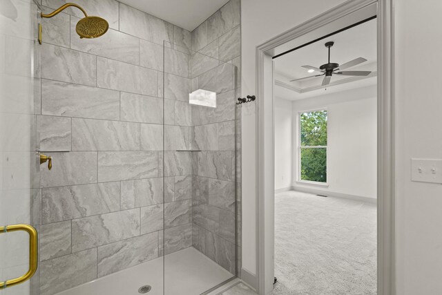 1704 Stillpoint Ct, Columbia, MO 65203 - bathroom with baseboards, ceiling fan, a stall shower, and a raised ceiling