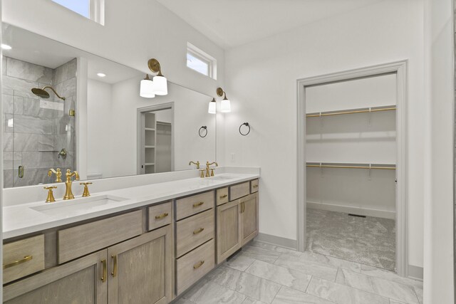 1704 Stillpoint Ct, Columbia, MO 65203 - full bathroom featuring marble finish floor, a sink, a stall shower, and a spacious closet