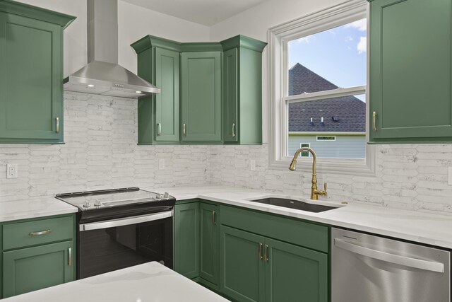1704 Stillpoint Ct, Columbia, MO 65203 - kitchen featuring green cabinets, a sink, wall chimney exhaust hood, and appliances with stainless steel finishes