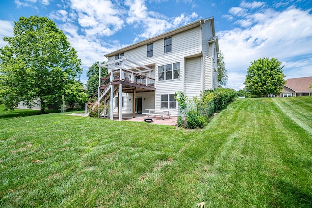 back of house featuring a yard, a deck, and a patio