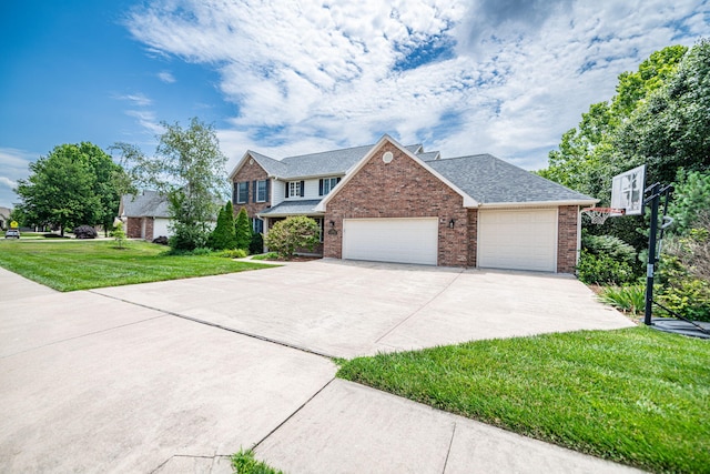 view of front of property featuring a front lawn and a garage