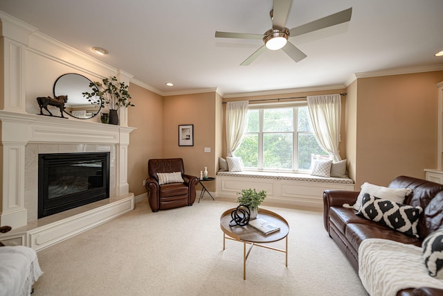 carpeted living room with ceiling fan, ornamental molding, and a fireplace