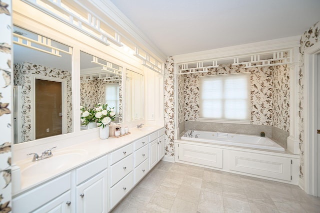 bathroom featuring a wealth of natural light, vanity, a bathing tub, and crown molding