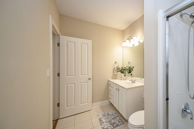 bathroom with walk in shower, vanity, tile patterned floors, and toilet