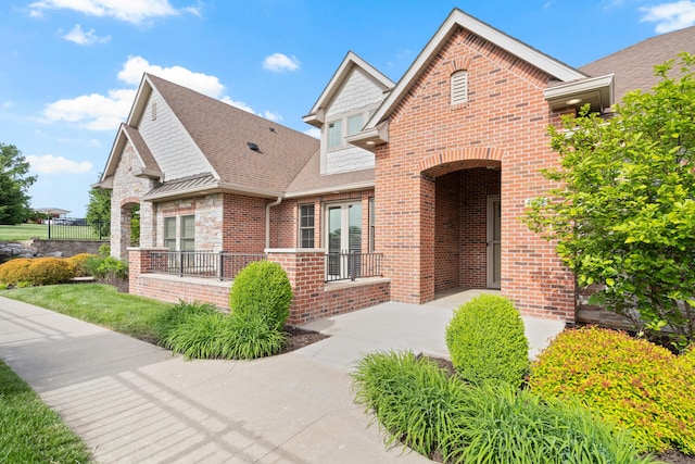1703 Linkside Dr, Columbia, MO 65201 - view of front of home with brick siding and roof with shingles