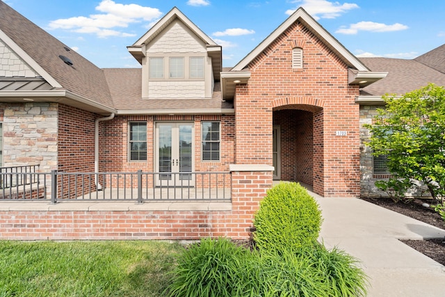 1703 Linkside Dr, Columbia, MO 65201 - view of front of home with a shingled roof, french doors, and brick siding