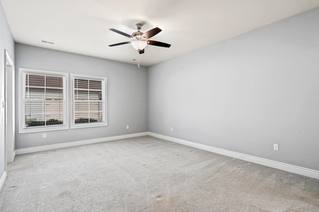 1703 Linkside Dr, Columbia, MO 65201 - spare room with a ceiling fan, carpet floors, and baseboards