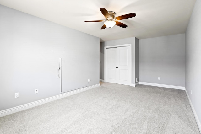 1703 Linkside Dr, Columbia, MO 65201 - unfurnished bedroom with a closet, carpet flooring, baseboards, and a ceiling fan