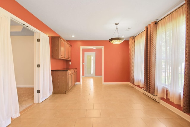 604 Adens Woods Ct, Columbia, MO 65201 - kitchen with recessed lighting, brown cabinets, decorative light fixtures, and dark countertops