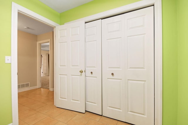 604 Adens Woods Ct, Columbia, MO 65201 - unfurnished bedroom featuring light tile patterned flooring and a closet