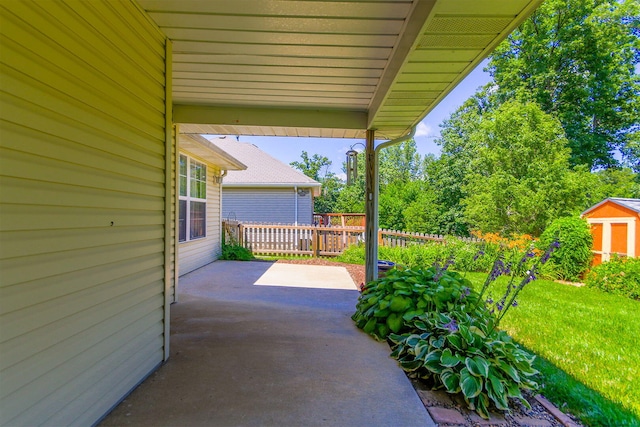 604 Adens Woods Ct, Columbia, MO 65201 - view of patio with a storage unit