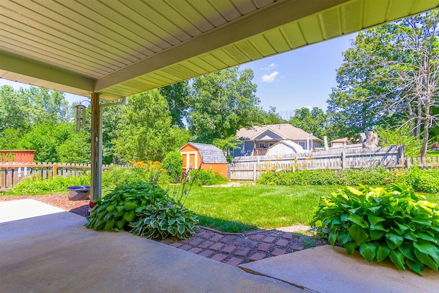 604 Adens Woods Ct, Columbia, MO 65201 - fenced backyard with a patio and a storage unit