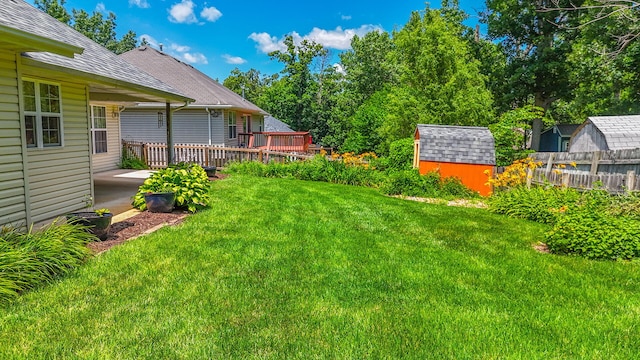 604 Adens Woods Ct, Columbia, MO 65201 - view of yard with a storage unit and a wooden deck