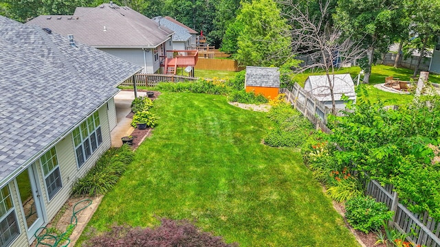 604 Adens Woods Ct, Columbia, MO 65201 - fenced backyard featuring an outdoor fire pit and a deck