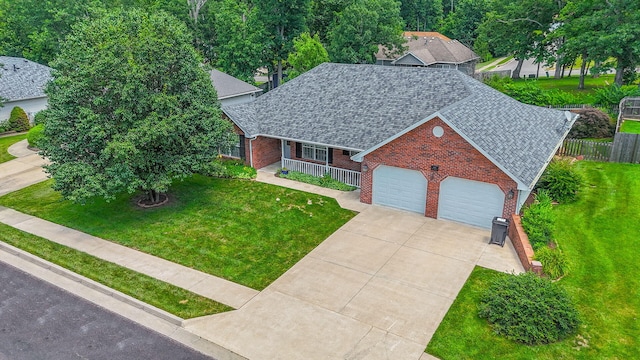 604 Adens Woods Ct, Columbia, MO 65201 - view of front facade featuring a shingled roof, brick siding, concrete driveway, covered porch, and an attached garage
