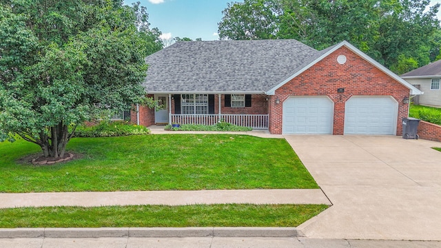 604 Adens Woods Ct, Columbia, MO 65201 - view of front of home with a garage, covered porch, a front yard, brick siding, and driveway