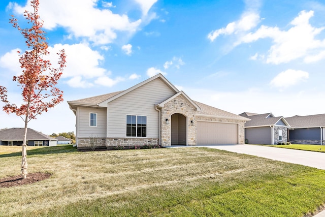 view of front of property with a garage and a front lawn