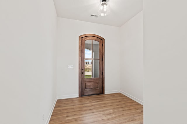 doorway to outside featuring light wood-type flooring