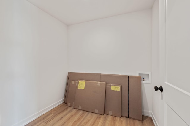 interior space featuring washer hookup and light wood-type flooring