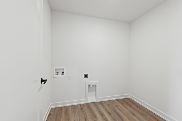 laundry area featuring washer hookup, hardwood / wood-style floors, and electric dryer hookup