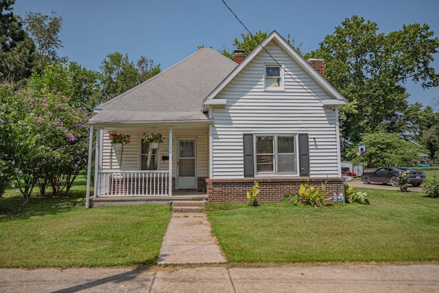 bungalow-style house featuring a front yard and a porch