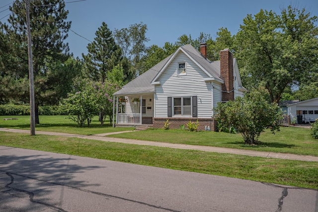 view of front facade with a front lawn and a porch