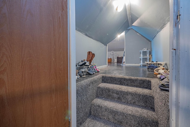 stairway with lofted ceiling