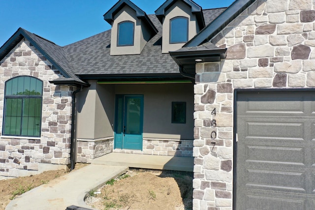 entrance to property featuring a garage