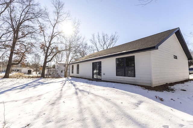 view of snow covered house