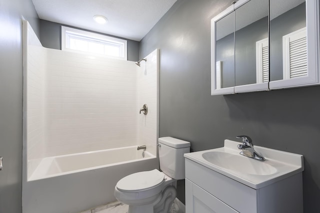 full bathroom featuring a textured ceiling, tub / shower combination, vanity, and toilet