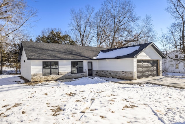 ranch-style home featuring a garage