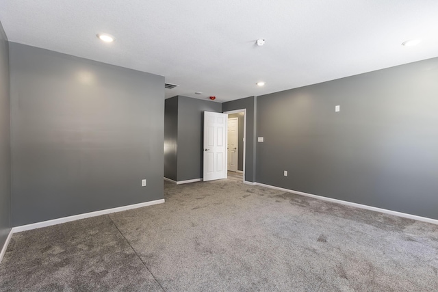 unfurnished room with carpet floors