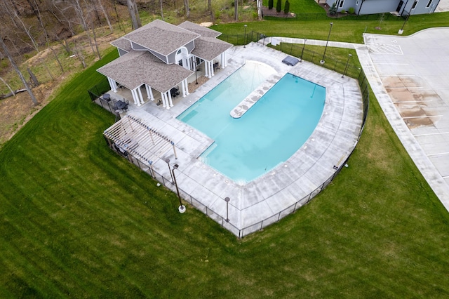 view of swimming pool featuring a patio area and a lawn