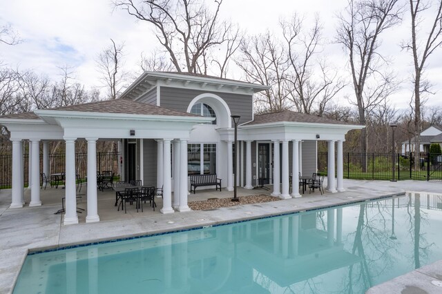 back of house with a patio and a fenced in pool