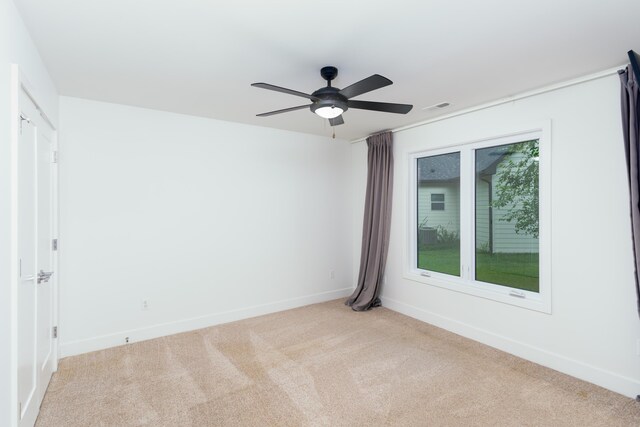 carpeted empty room with ceiling fan