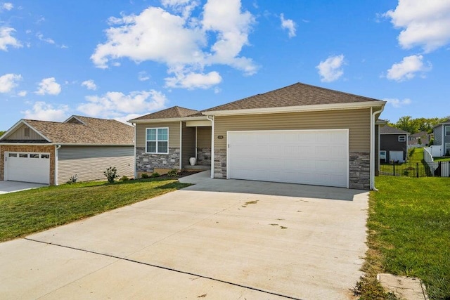 view of front of property with a garage and a front lawn