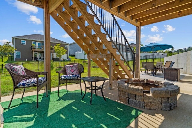 view of patio featuring a pergola and a fire pit