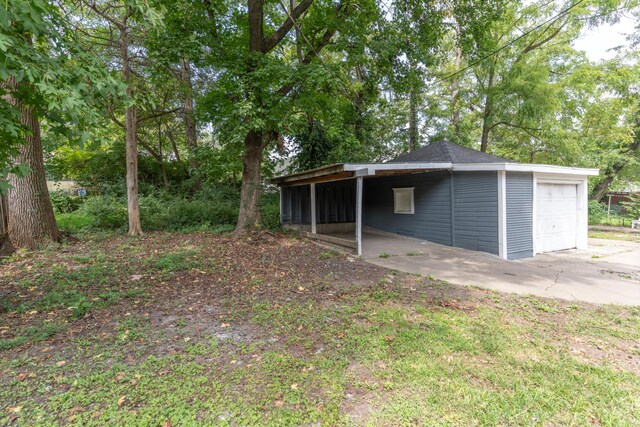 exterior space with a detached garage