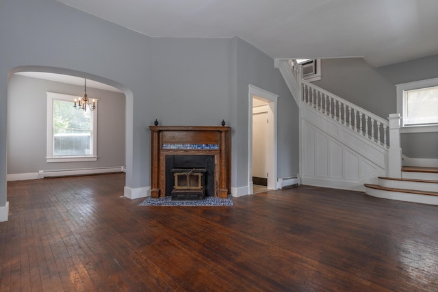 unfurnished living room with a baseboard radiator, stairway, baseboard heating, hardwood / wood-style floors, and plenty of natural light