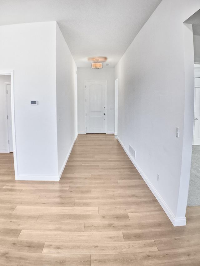 hallway featuring light hardwood / wood-style flooring