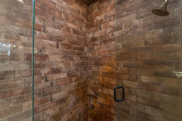 bathroom with a shower stall