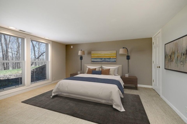 bedroom featuring carpet flooring, visible vents, and baseboards